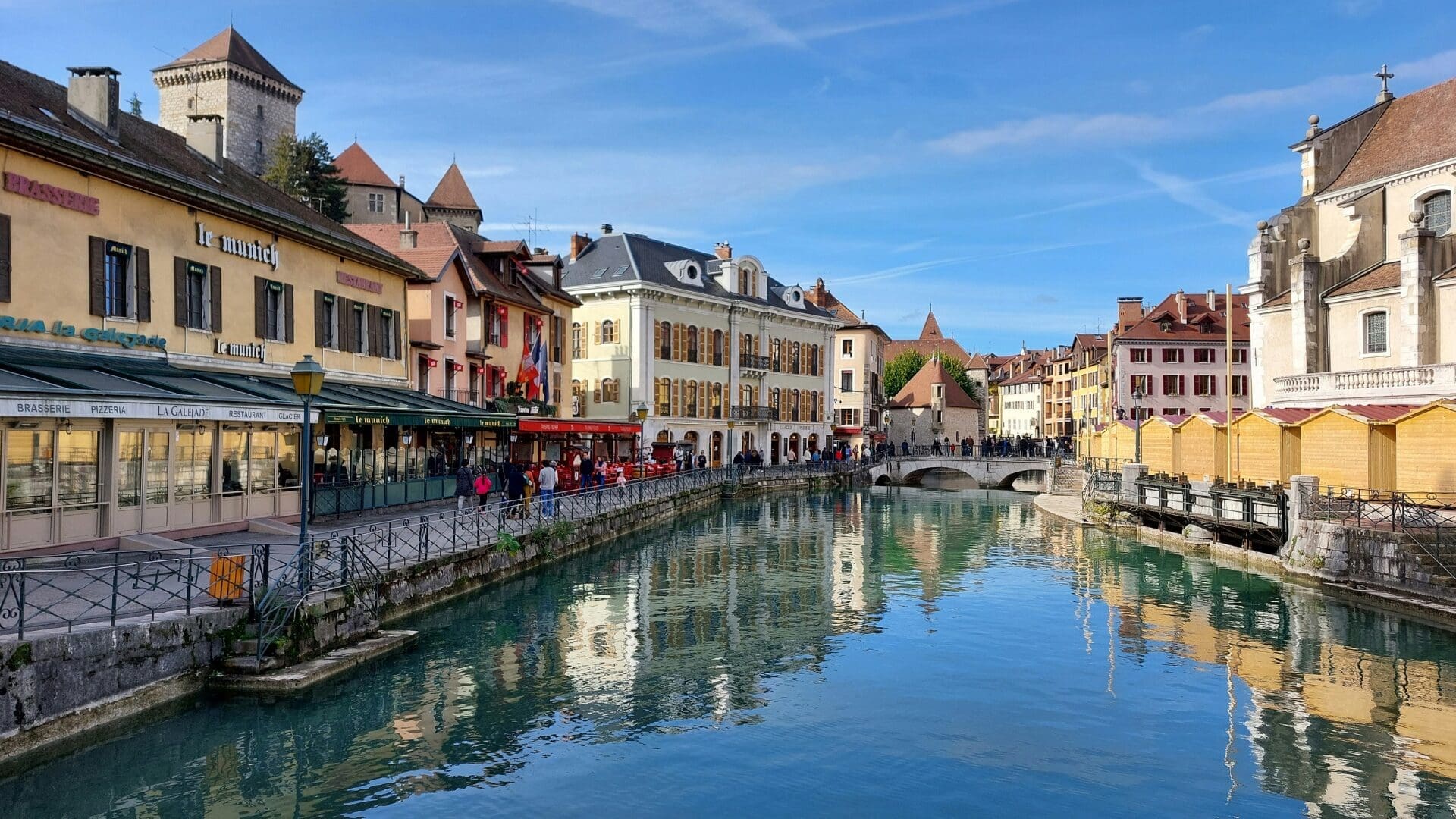Annecy old town canals with colourful buildings and waterside restaurants, a classic French lake holiday setting